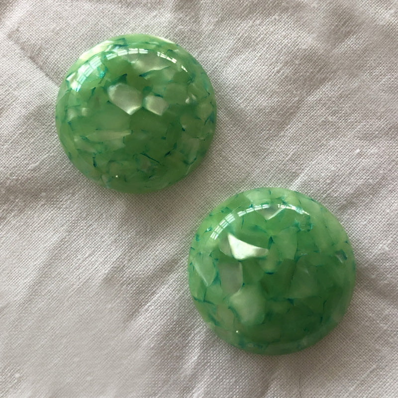 Green plastic magnet tiebacks